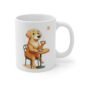A white coffee mug with a picture of a yellow dog on it drinking a coffee