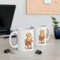 Two identical mugs featuring images of a dog drinking a cup of coffee or tea.